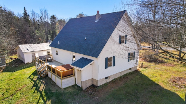 back of house with a yard and a deck