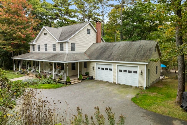 view of front of home with a garage and covered porch