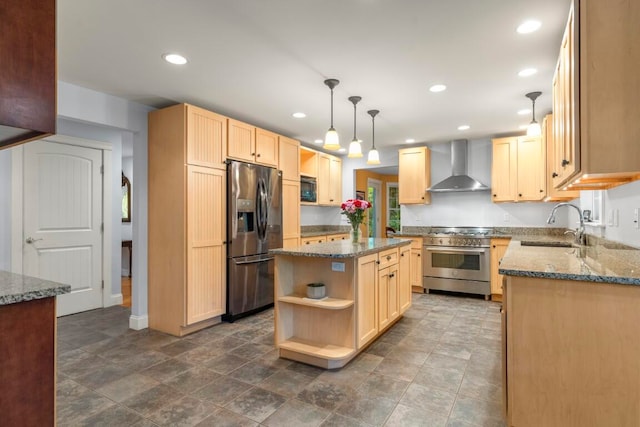 kitchen with sink, wall chimney range hood, light brown cabinetry, a kitchen island, and appliances with stainless steel finishes