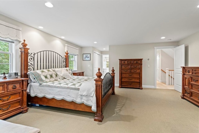 bedroom featuring light colored carpet