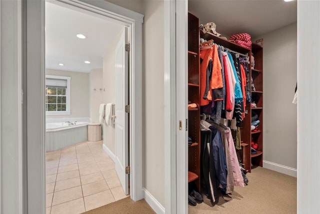 spacious closet featuring light tile patterned floors