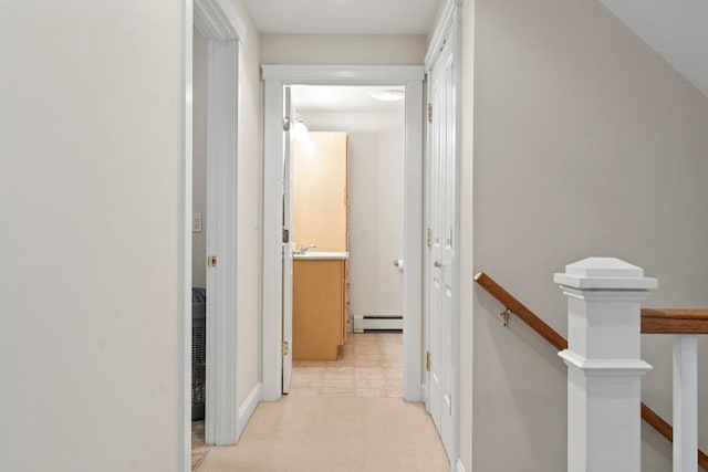 corridor featuring a baseboard heating unit