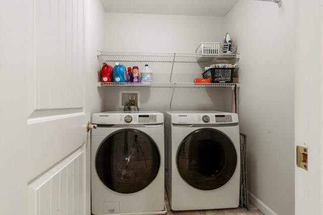 washroom featuring washer and dryer