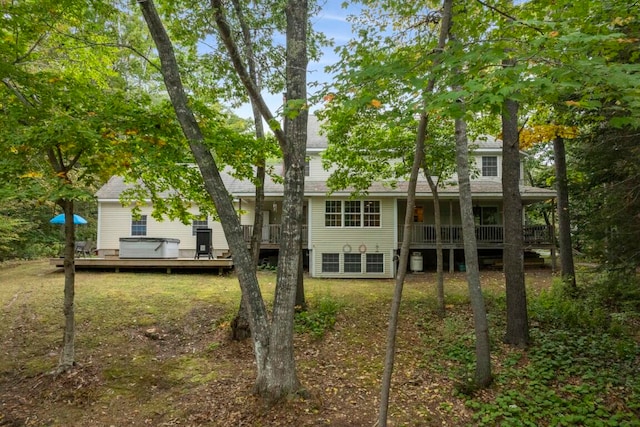 rear view of property with a deck