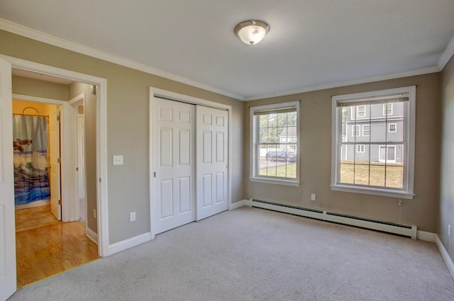 unfurnished bedroom featuring ornamental molding, light carpet, a closet, and a baseboard radiator