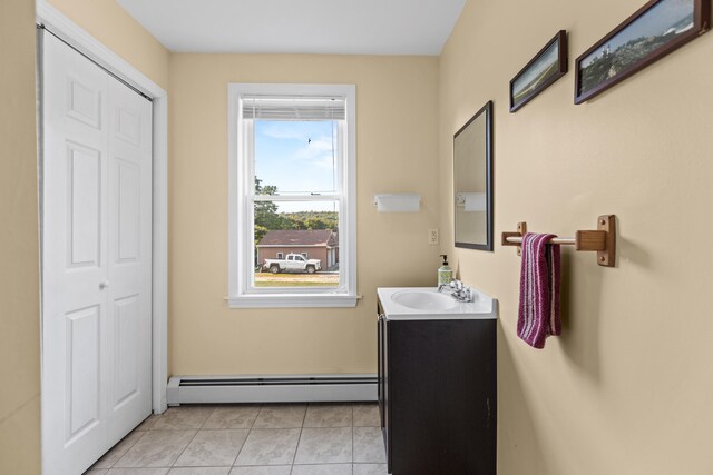 bathroom featuring baseboard heating, vanity, and tile patterned floors