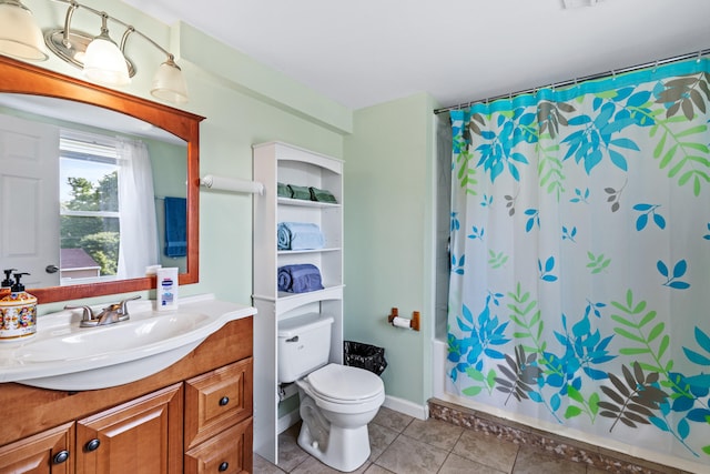 full bathroom featuring tile patterned flooring, vanity, shower / bath combo with shower curtain, and toilet