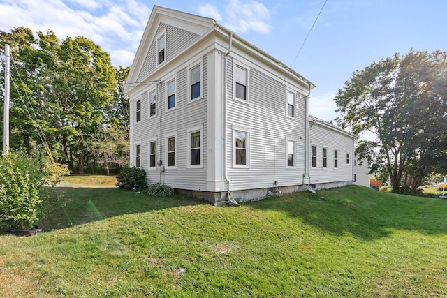 view of home's exterior featuring a lawn