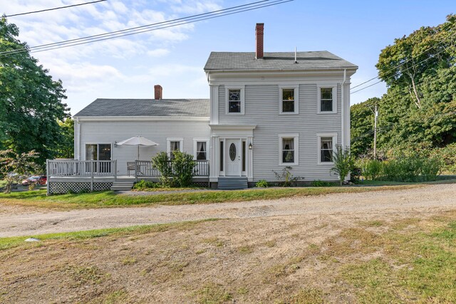 greek revival house with a deck