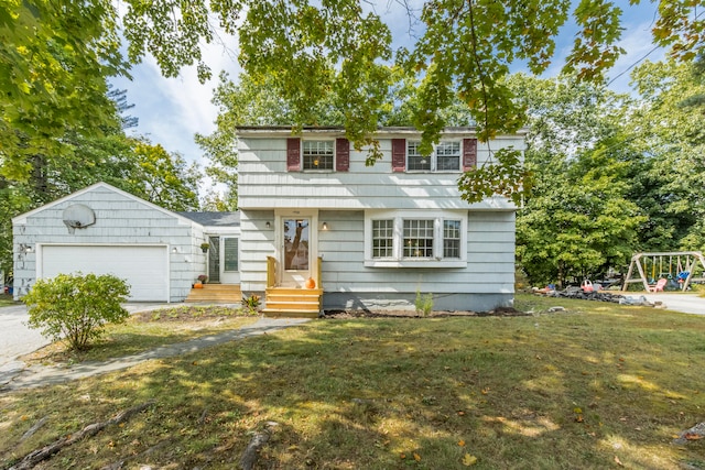 view of front of property with a garage and a front yard