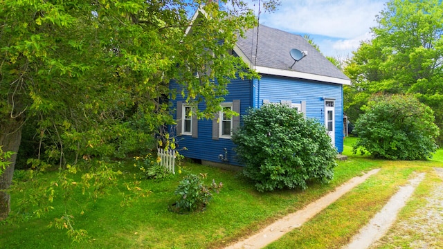 view of home's exterior featuring a lawn