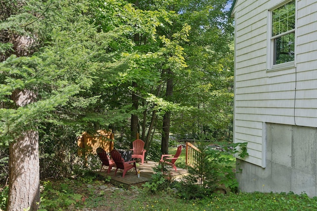 view of yard with a wooden deck