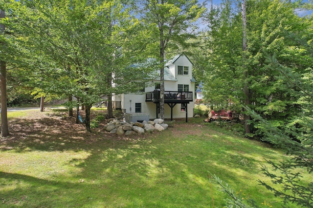 view of yard featuring a wooden deck