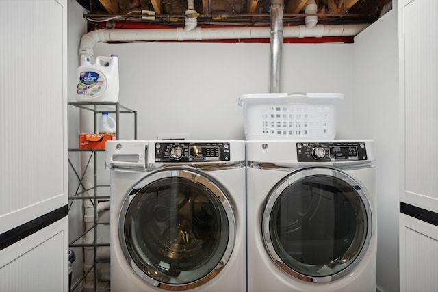 clothes washing area featuring washing machine and clothes dryer