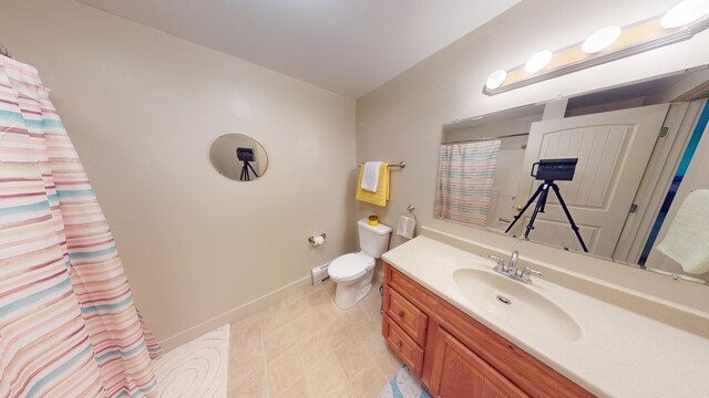 bathroom featuring walk in shower, vanity, and toilet