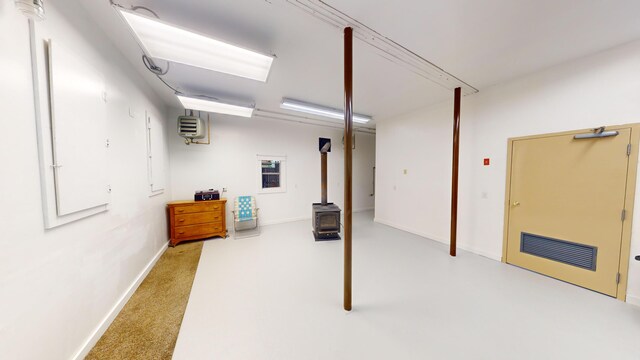 basement featuring a wood stove