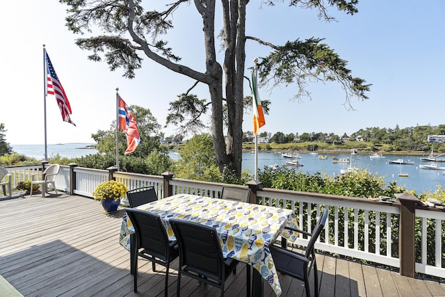 12 Steamboat Wharf Ln, Harpswell, ME 04079 - wooden deck with a water view and outdoor dining space