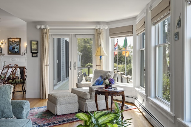 12 Steamboat Wharf Ln, Harpswell, ME 04079 - sunroom with a baseboard heating unit, a wealth of natural light, and wood finished floors