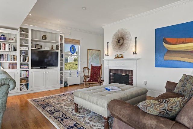 12 Steamboat Wharf Ln, Harpswell, ME 04079 - living room with crown molding, a brick fireplace, recessed lighting, baseboards, and wood finished floors