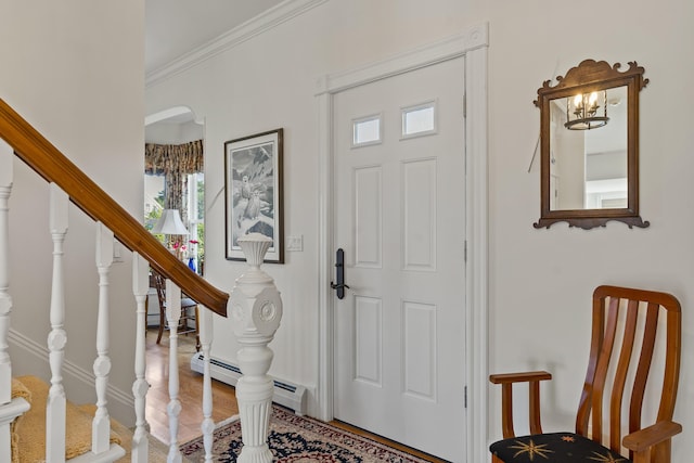 12 Steamboat Wharf Ln, Harpswell, ME 04079 - foyer entrance with crown molding, stairs, wood finished floors, and a wealth of natural light