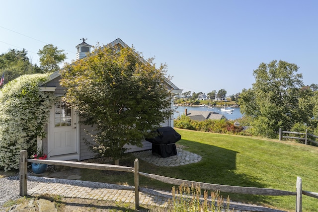 12 Steamboat Wharf Ln, Harpswell, ME 04079 - view of yard featuring a water view, fence, and an outbuilding