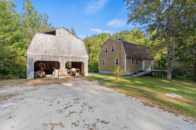 exterior space with an outbuilding and a yard