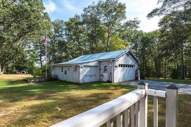 garage with aphalt driveway