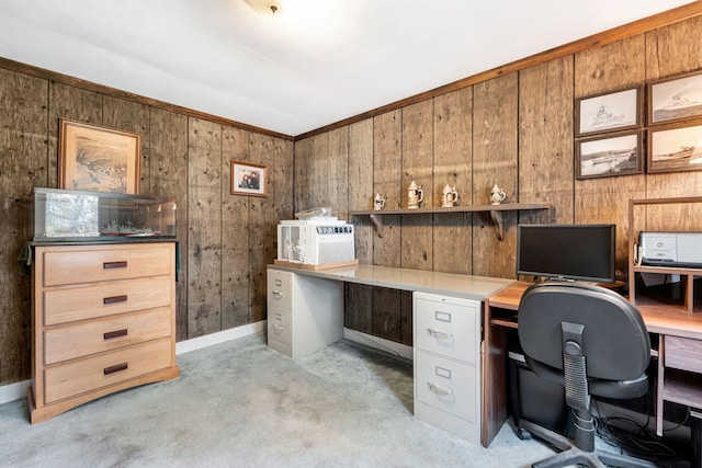 office space with light carpet and wooden walls