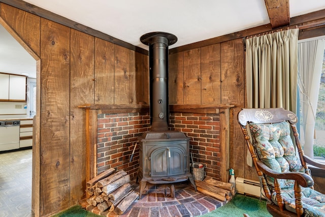 details with wooden walls, a wood stove, and dishwasher
