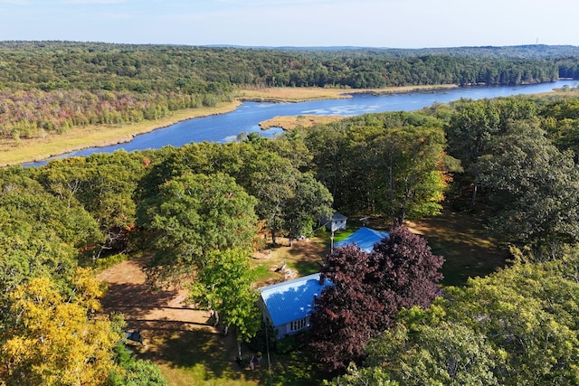 drone / aerial view featuring a water view and a view of trees