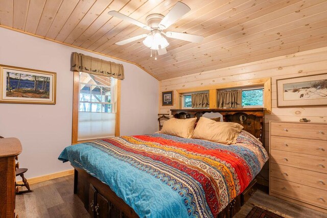 bedroom featuring wood ceiling, lofted ceiling, ceiling fan, and dark wood-type flooring