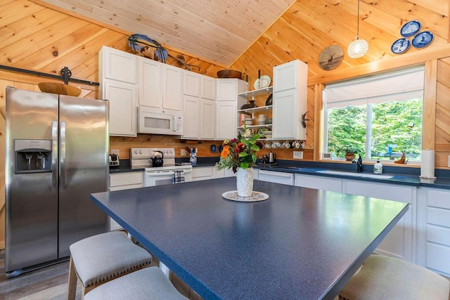 kitchen featuring wooden ceiling, white appliances, white cabinetry, and sink