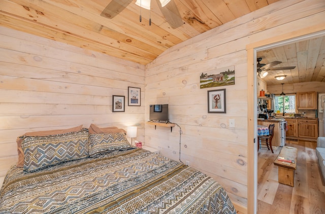 bedroom with light wood-type flooring, wooden walls, and vaulted ceiling