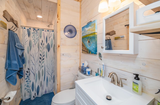 bathroom with walk in shower, vanity, wood walls, and toilet