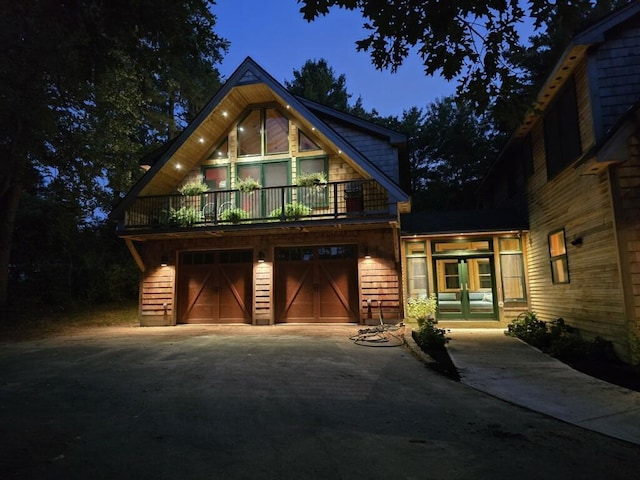 view of front of property with french doors and a garage