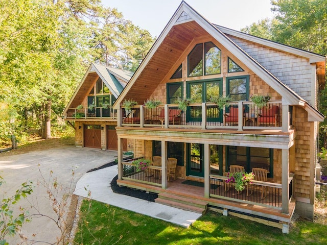 back of property featuring a balcony