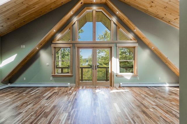 interior space featuring baseboard heating, beamed ceiling, french doors, and hardwood / wood-style flooring