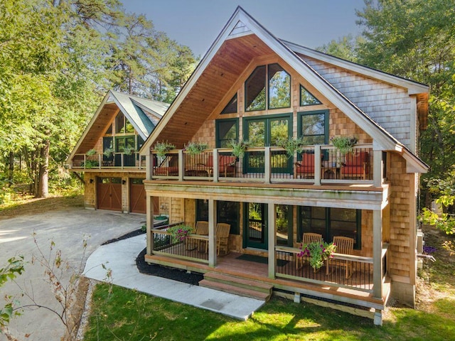 back of house with a balcony