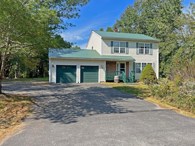 front facade with a porch and a garage