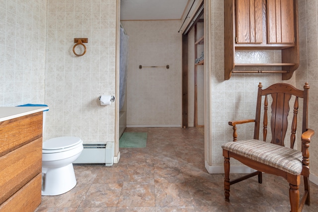 bathroom with tile walls, toilet, a baseboard heating unit, and a shower with curtain