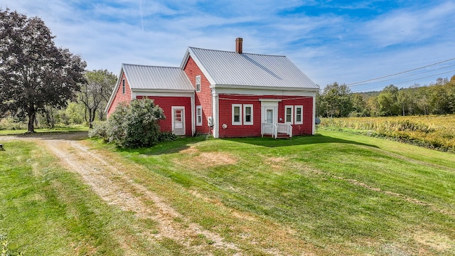 view of home's exterior with a lawn