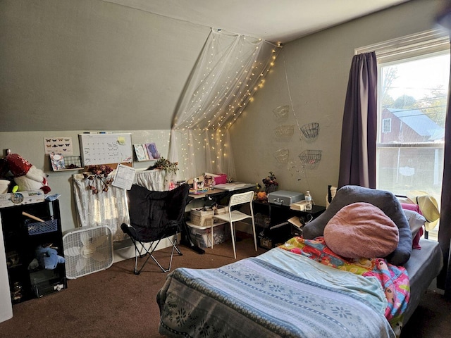 bedroom featuring lofted ceiling and carpet flooring