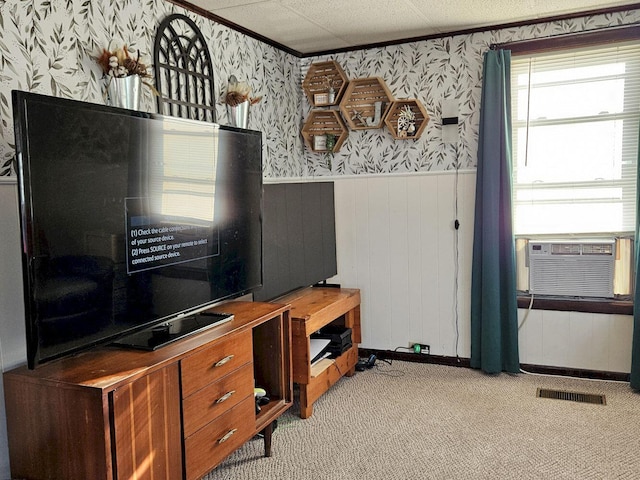 interior space featuring light colored carpet and wood walls