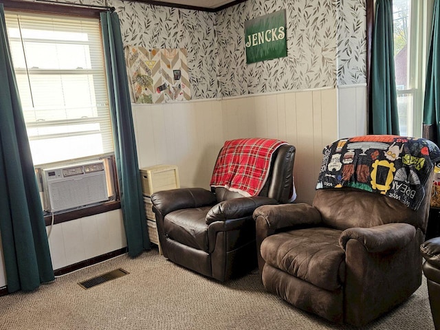 sitting room featuring cooling unit and carpet flooring