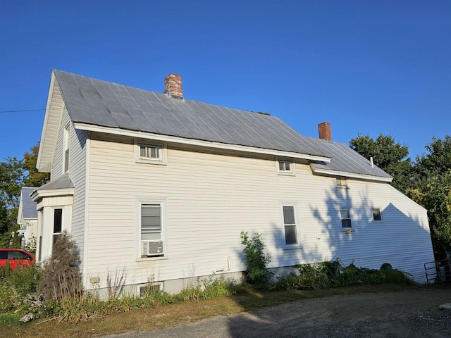 view of side of property with cooling unit