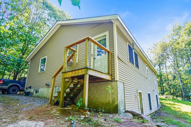 view of side of property featuring a deck