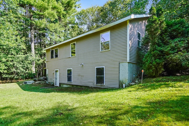 back of house with a yard