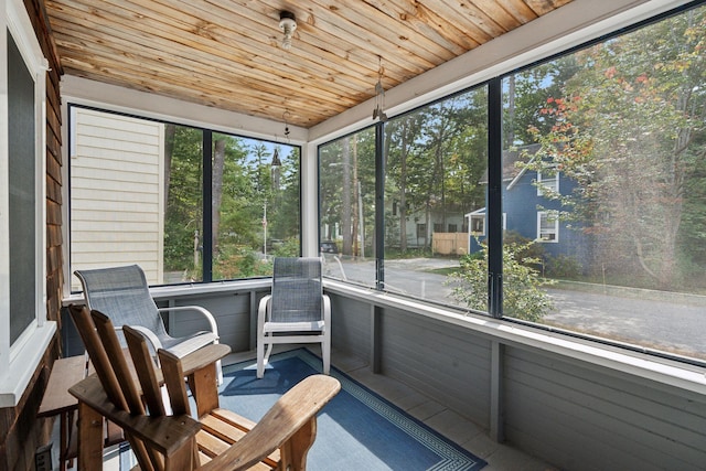 unfurnished sunroom featuring wooden ceiling