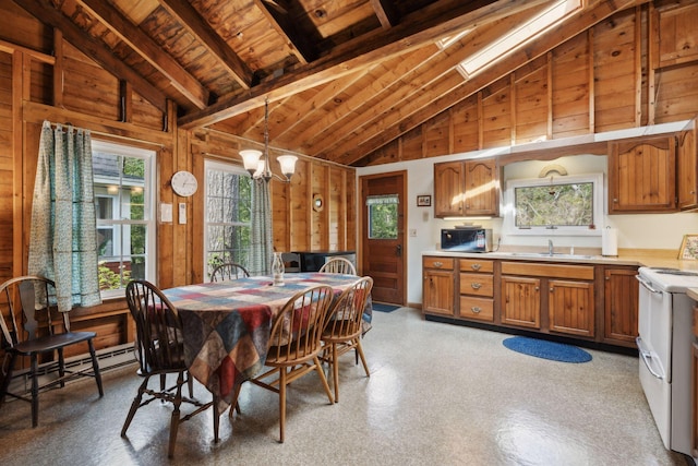 interior space featuring a notable chandelier, wooden walls, white range with electric stovetop, and vaulted ceiling with skylight