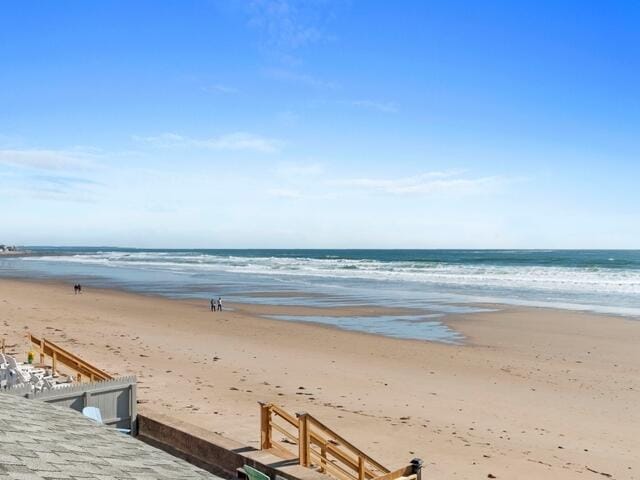 view of water feature with a beach view